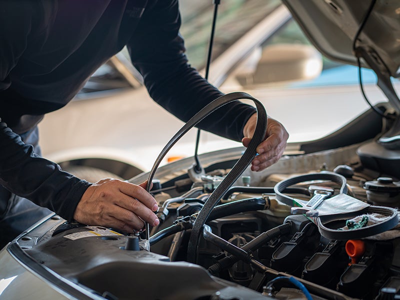 Mechanic inspecting a car engine
